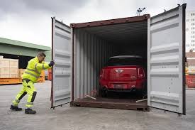 Car being loaded into container